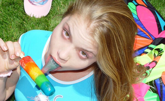 Little April - Little April flying here kite and sucking an ice cream